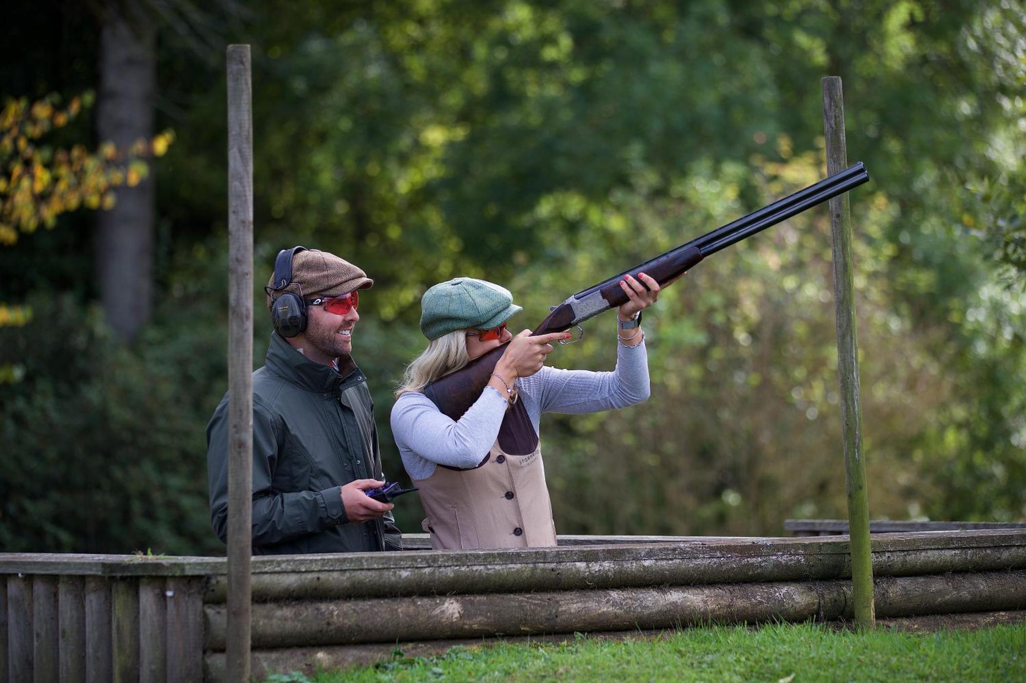 Schloss Roxburghe, Part Of Destination By Hyatt Екстер'єр фото A woman shooting with a shotgun