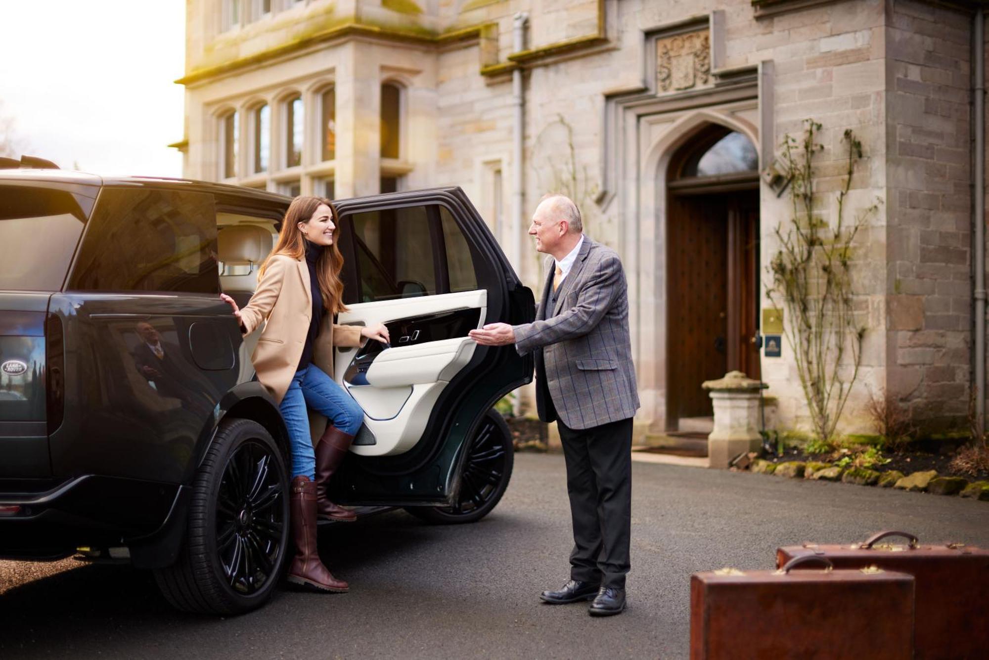 Schloss Roxburghe, Part Of Destination By Hyatt Екстер'єр фото A chauffeur opening the car door for a passenger